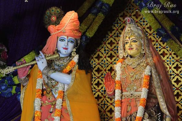 Shri Radha Krishn in orange at Shyama Shyam Dham, Vrindavan.