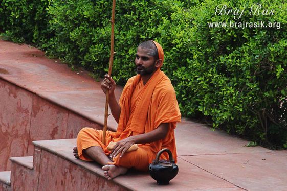 A saint seated at Brahma Kunda looking at Lord Brahma.