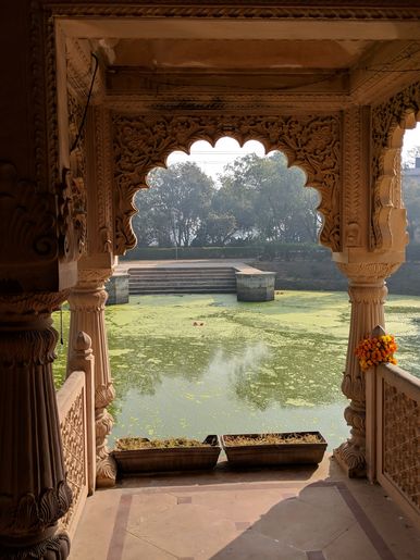 View of Vrinda Kund from inside Vrinda Devi Temple