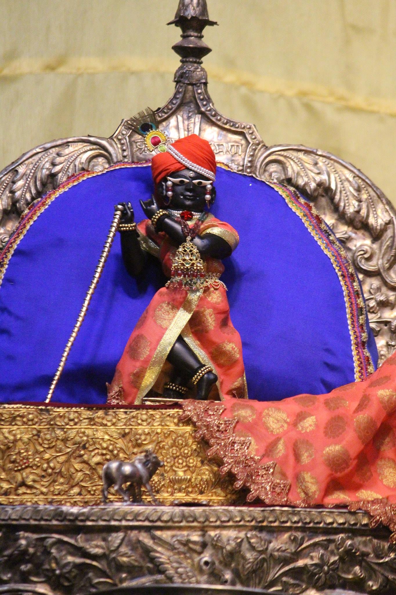 Shri Radharaman Ji in light pinkish Orange Attire.