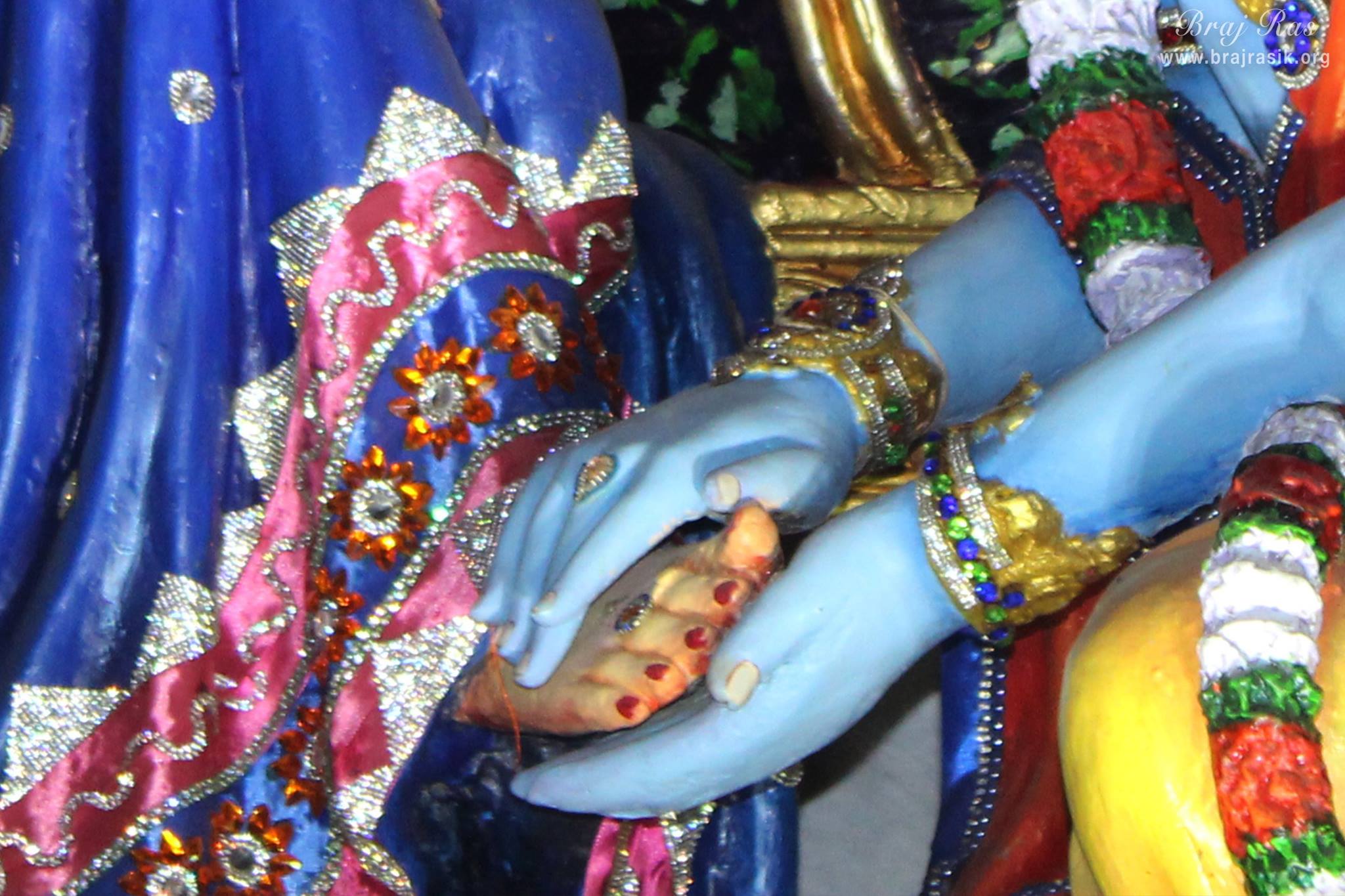 Darshan of Shri Krishna doing foot massage of Shri Radha Rani in Prem Mandir