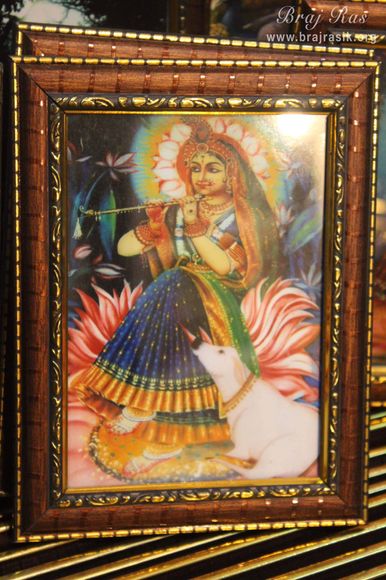 Photoframe of Shri Radharani holding flute in her hand in Banke Bihari Gali, Vrindavan