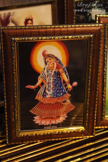 Photoframe of Shri Radharani holding pink lotus in her left hand in Banke Bihari Gali, Vrindavan