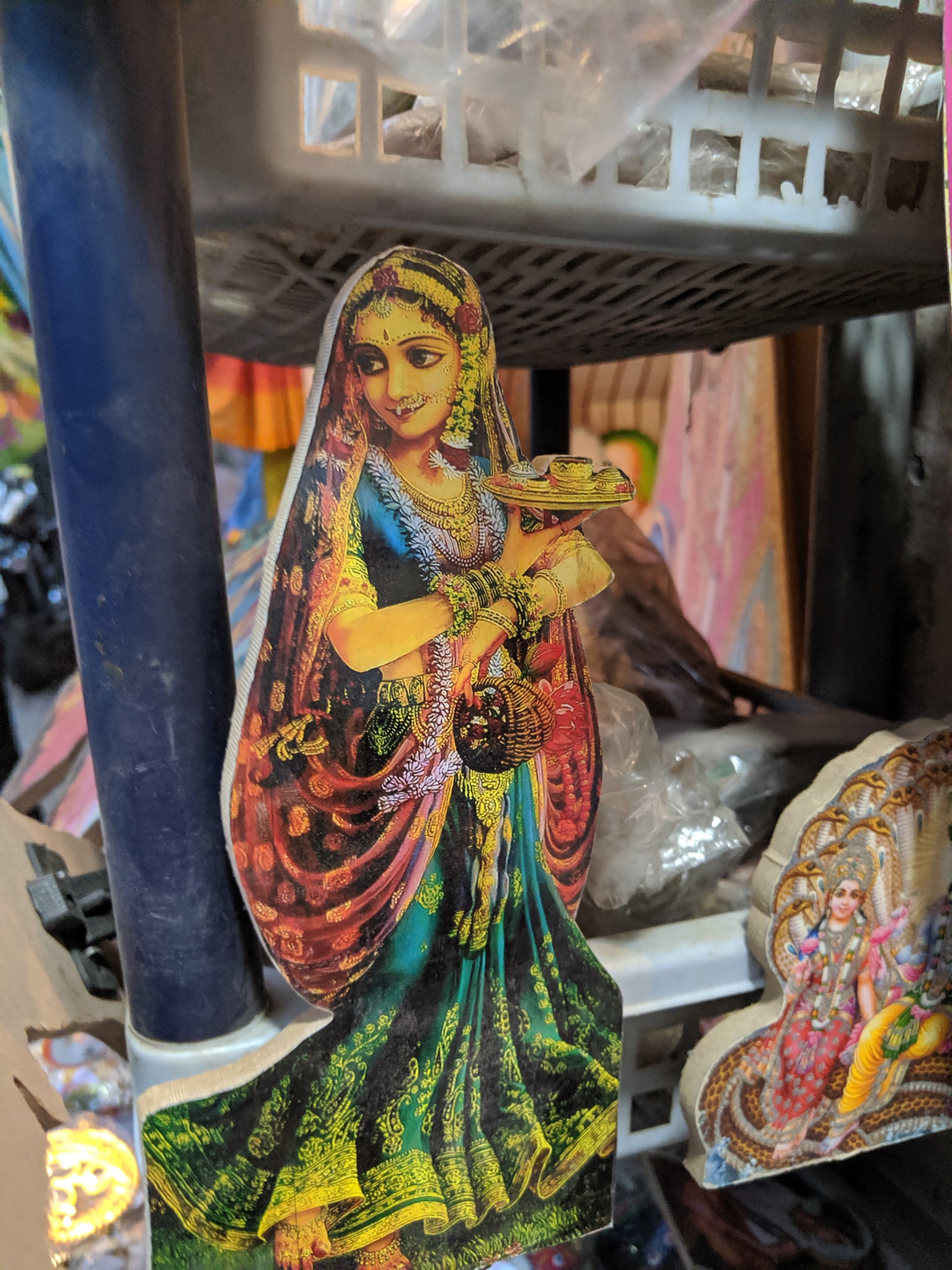 Portrait stand of a gopi in Banke Bihari Gali, Vrindavan