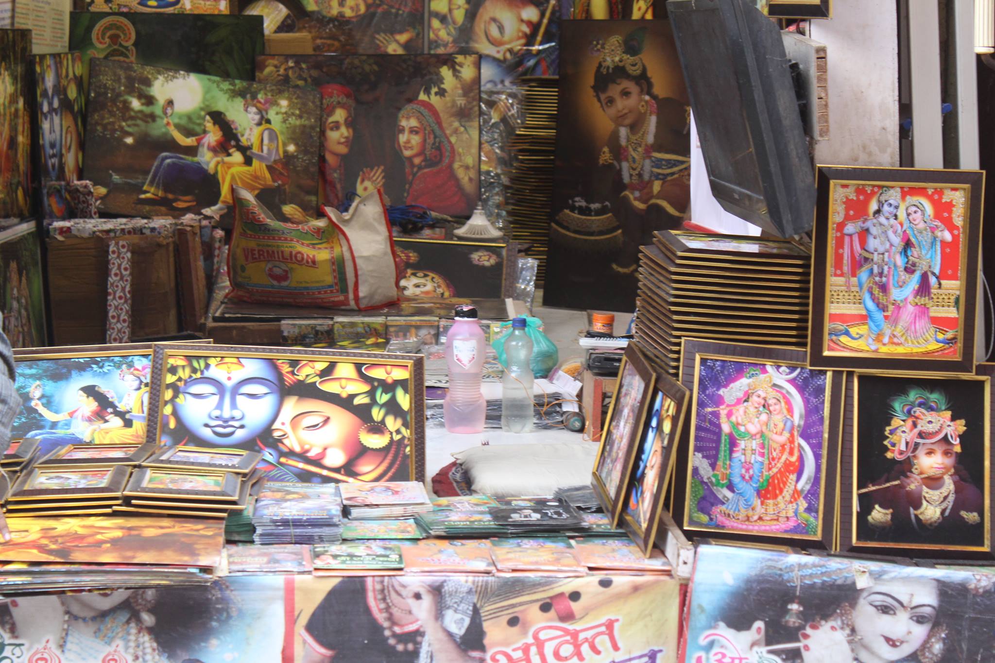 A shop with various photo stands of Shri Radha Krishna in Banke Bihari Gali, Vrindavan