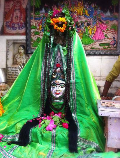 Darshan of Lord Shiva in a gopi form in green attire at Shri Gopeshwar or Gopishwar Mahadev, Vrindavan