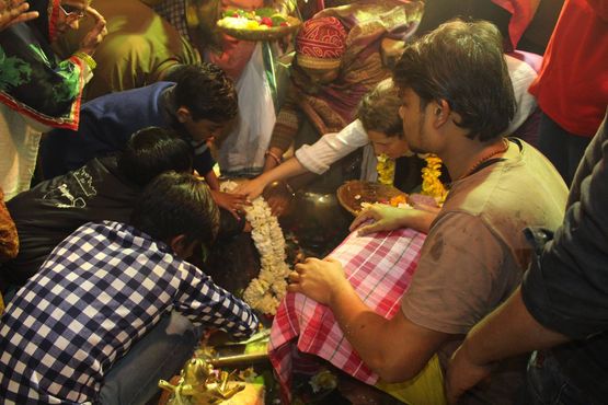 Devotees worshipping lord shiva by touching shiv linga at Shri Gopeshwar or Gopishwar Mahadev, Vrindavan