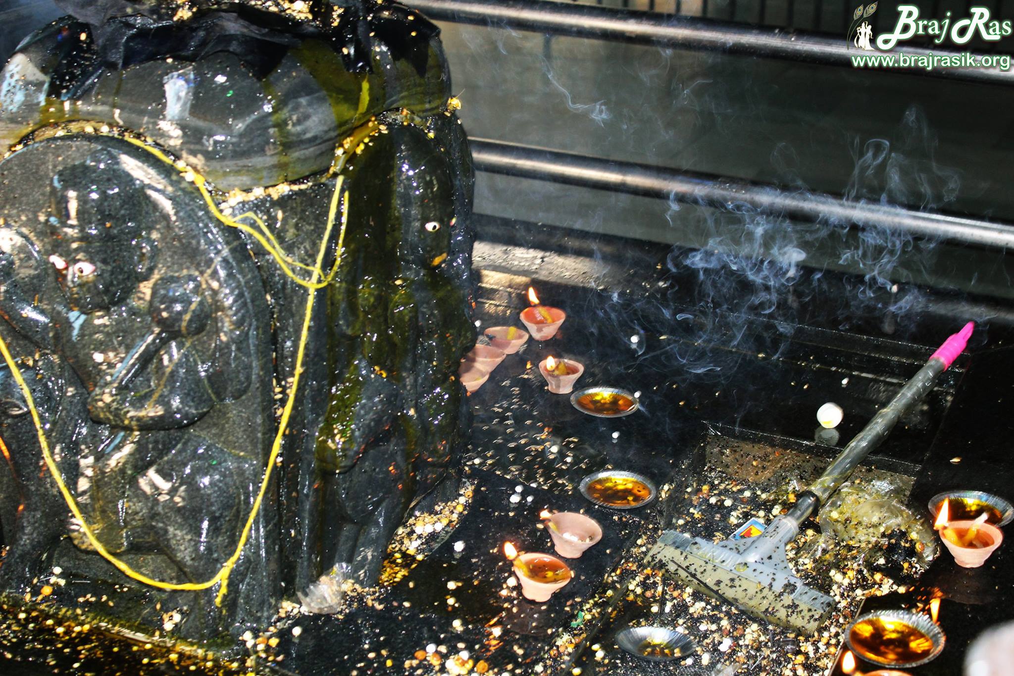 Burning lamps at Shani Dev in Kokila Van