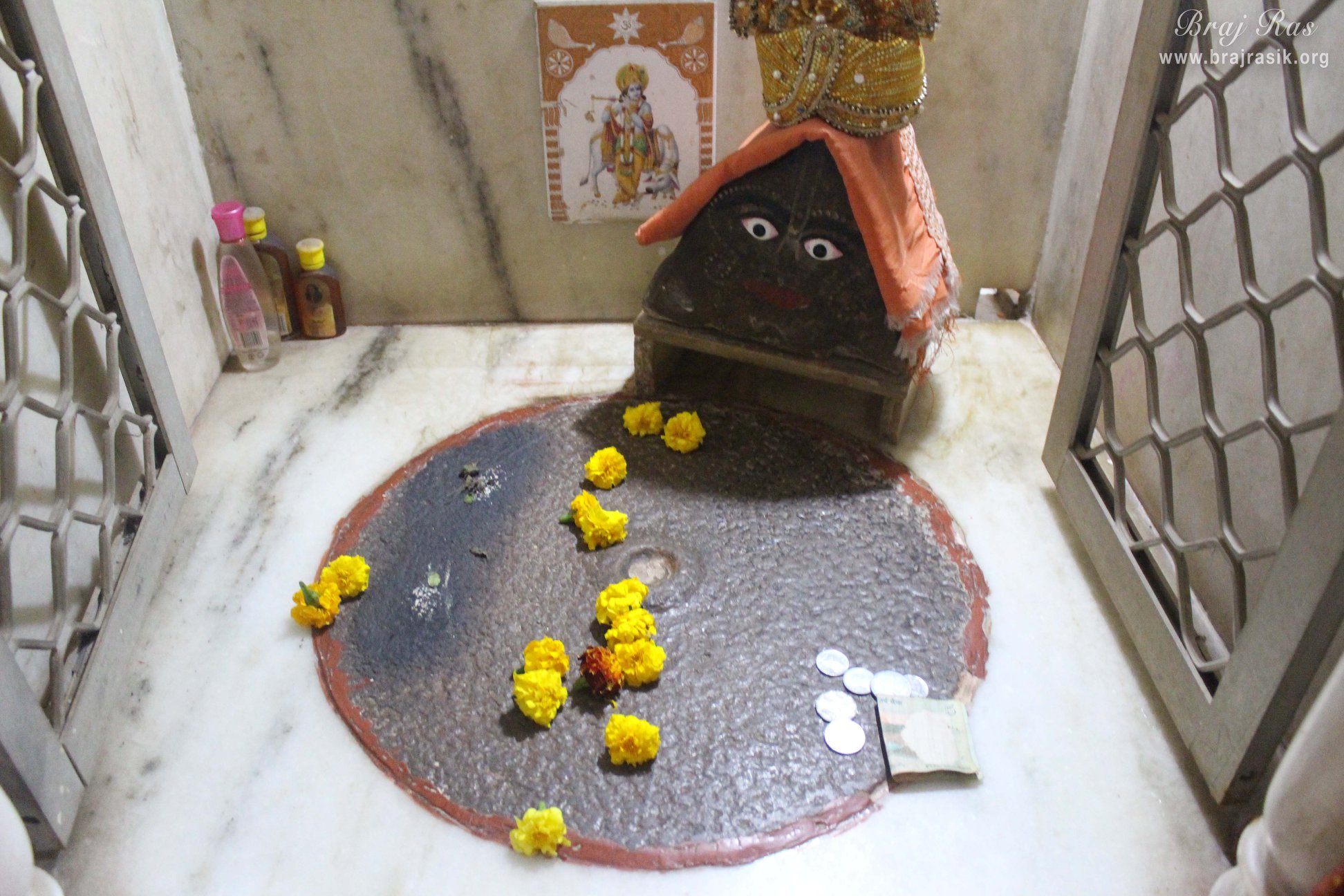 View of Shri Krishna's foot print on a grindstone at Jhadu Mandal, Vrindavan