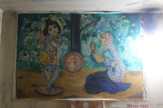 Painting of an old lady who was a devotee of Shri Krishna and Shri Krishna gave his footprints on a grindstone to her at Jhadu Mandal, Vrindavan