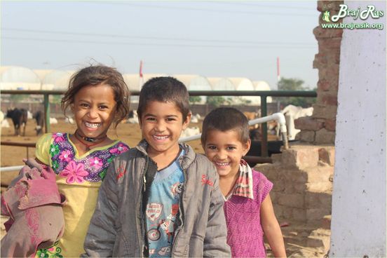 Childrens who do sewa work at goshala are smiling at Mataji Goshala, Barsana