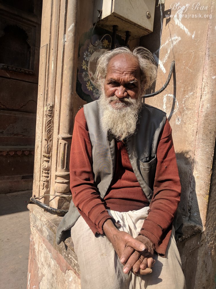 A devotee seated outside Old Radha Vallabh Temple, Vrindavan