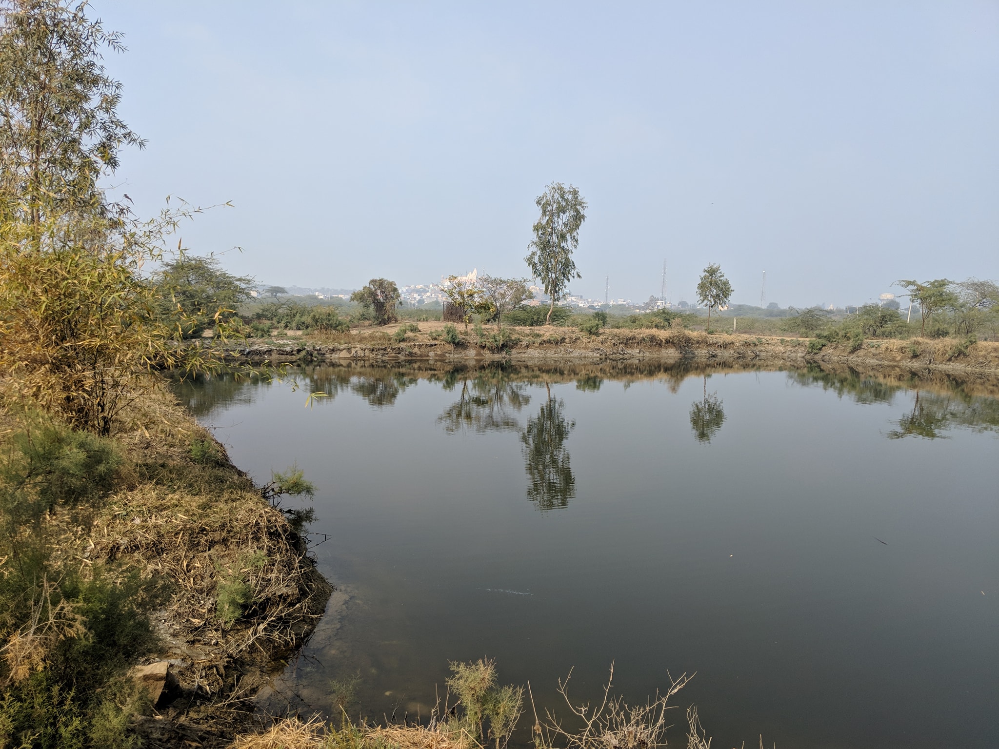 A beautiful view of kund at Uddhav Kyari, Nandgaon, with Nand Palace behind view at Nandgaun