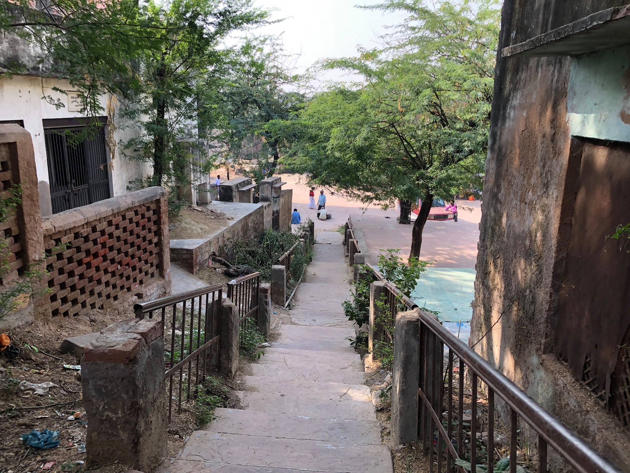 Stairs leading to Shri Radhasarovar at Gehvar van forest from Rasik saint Shri Nagridas Bhajan Kutir.
