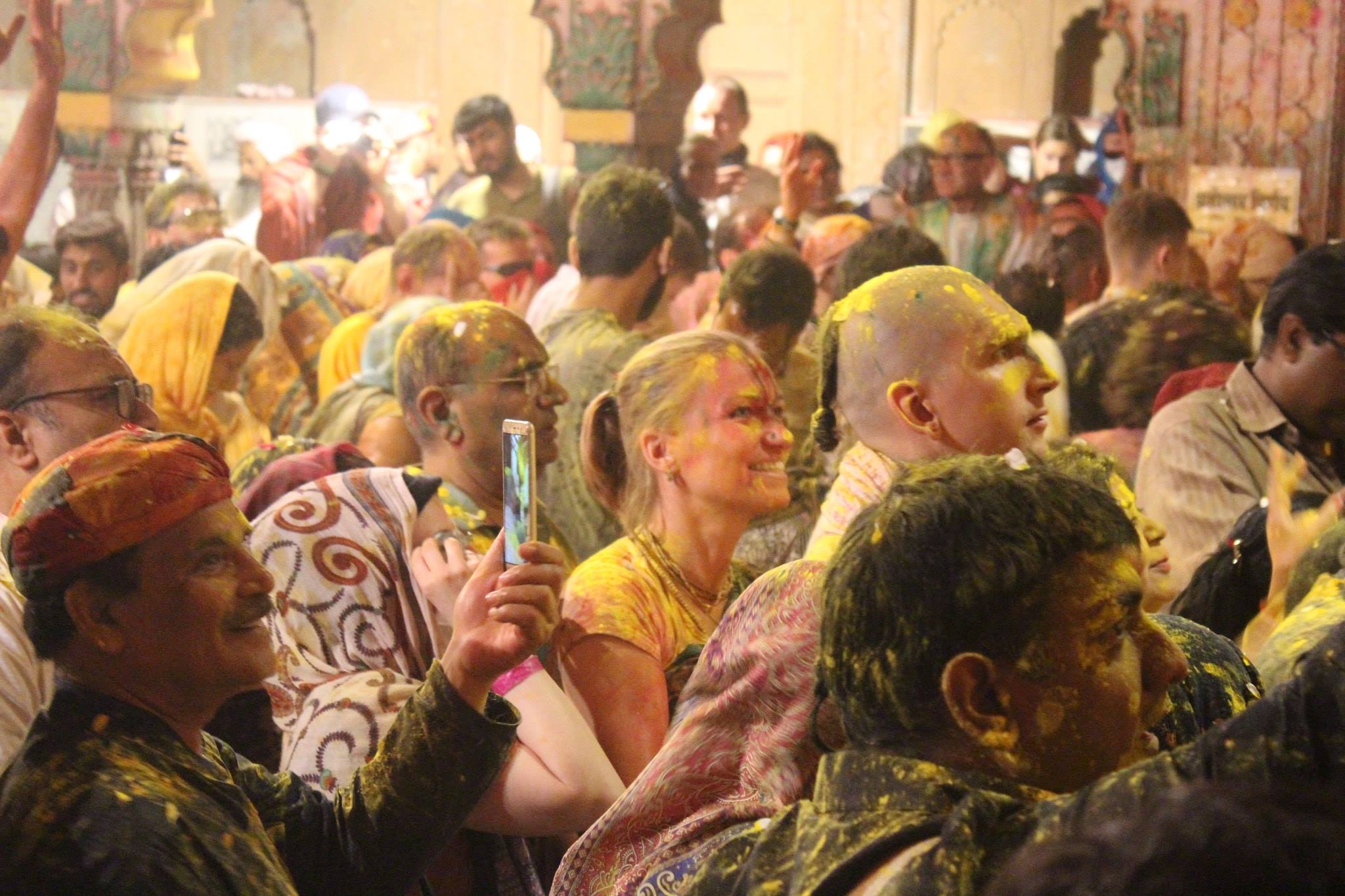 People enjoying darshan on Holi evening at Shri Radharaman Temple, Vrindavan