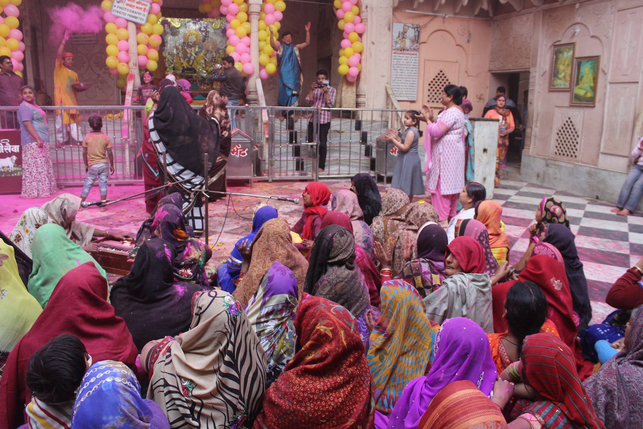 Devotees having darshan during Holi festival in Shri Radha Damodar Temple, Vrindavan