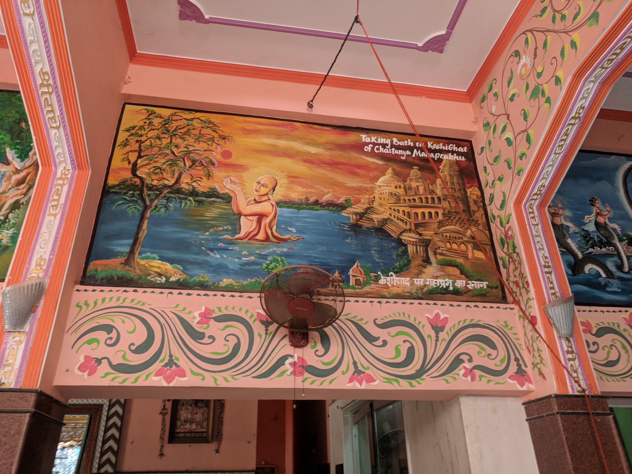 The painting of Shri Chaitanya Mahaprabhu taking bath in Shri Yamuna Ji at Keshi Ghat depicted on the wall of the temple at Advaita Vata, Vrindavan