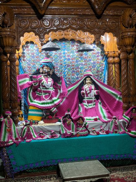 Shri Radha Krishna darshan in dark pink attire at Advaita Vata, Vrindavan