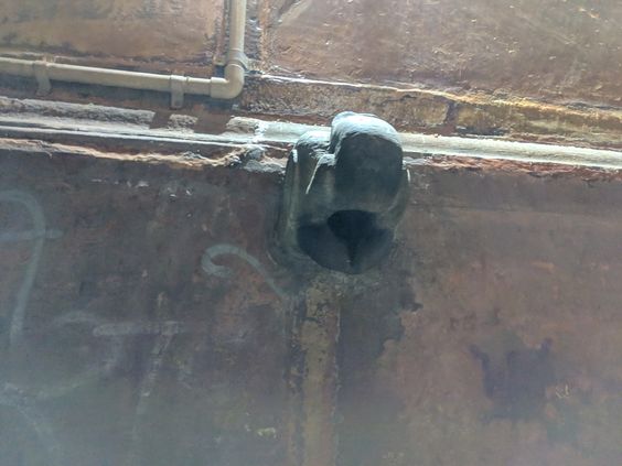Night view of a carved elephant head on the wall of Banke Bihari Temple's Parikrama path in Vrindavan