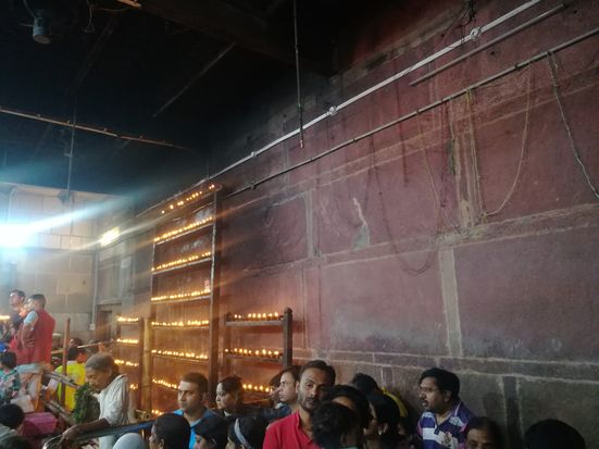 Hundreds of lamps burning inside Shri Bankey Bihari Temple, Vrindavan