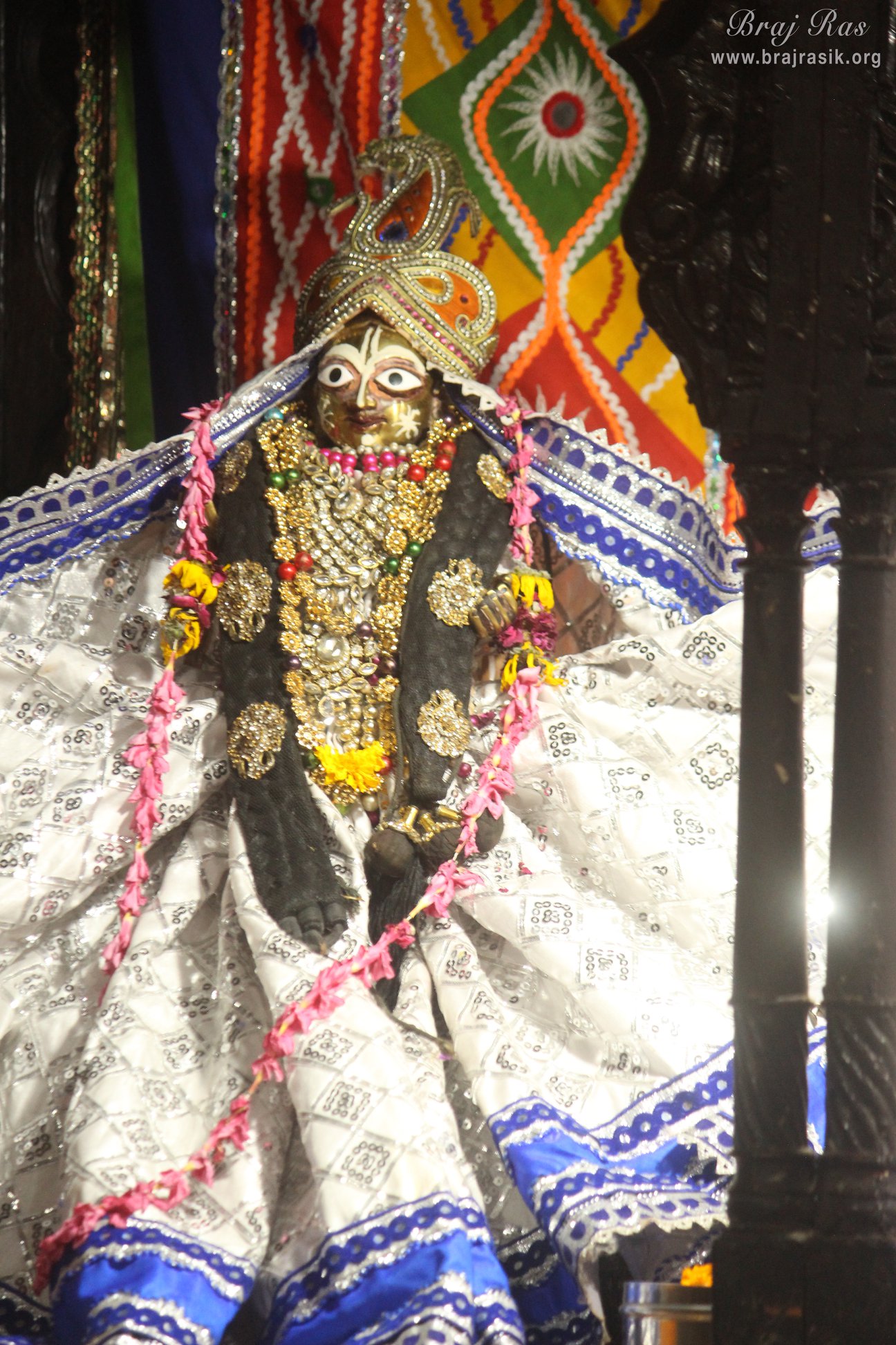 Full view darshan in white attire of Shri Jahnava Thakurani in Shri Radha Gopinath Ji Temple, Vrindavan