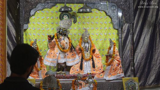 Darshan of Shri Radha Krishna in light orange attire at Shriji Ka Mandir, Vrindavan