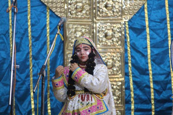 A sakhi of Shri Radha in white attire in Raas Leela, Vrindavan