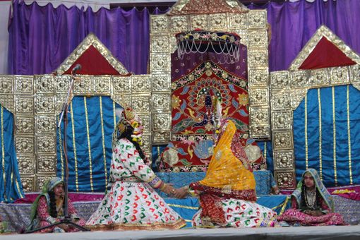 Darshan of Shri Radha Krishna in white attire doing a Leela pastime in Raas Leela, Vrindavan