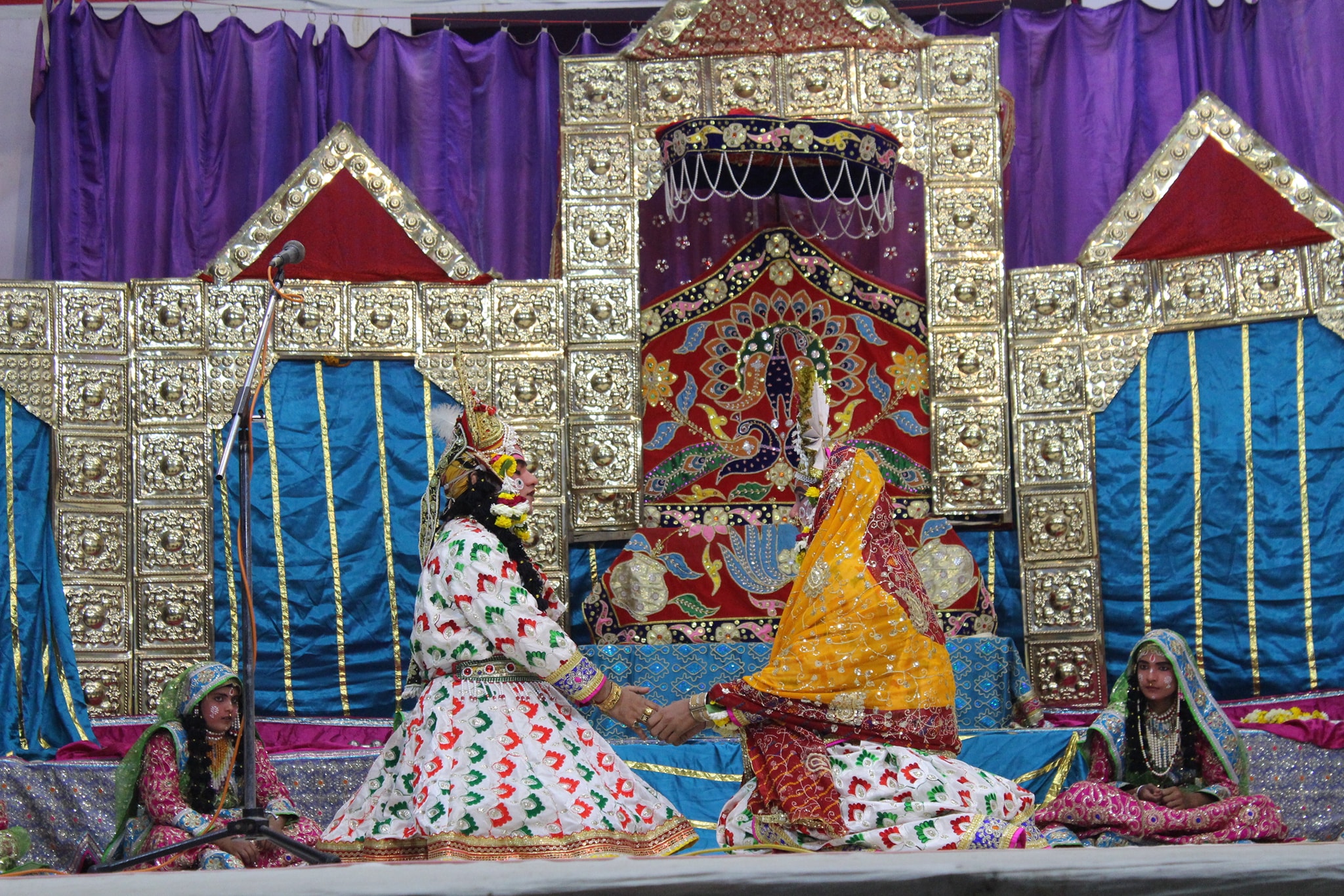 Darshan of Shri Radha Krishna in white attire doing a Leela pastime in Raas Leela, Vrindavan