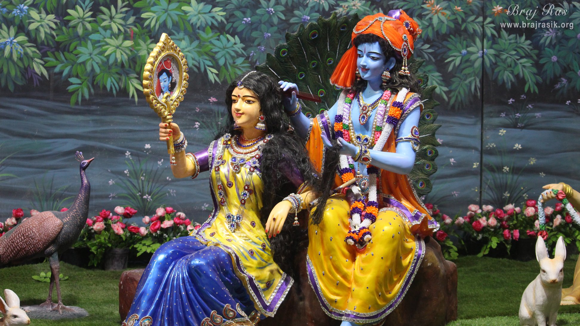 Shri Krishn decorating Shri Radha Rani [Veni Gunthan Leela or Shringar Vat Leela] at Prem Mandir, Vrindavan