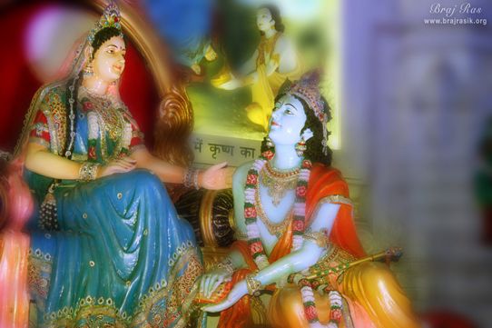 Shri Krishn serving the lotus feet of Shri Radha at Prem Mandir, Vrindavan