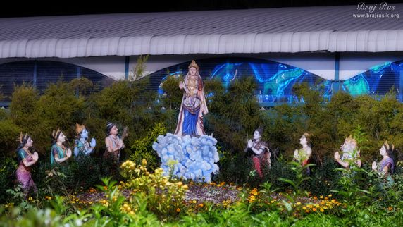 Brahma, Vishnu, and Shiva with Narada, Indra, Sarasvati, Laxmi and Parvati, etc worshipping Shri Radharani at Prem Mandir, Vrindavan