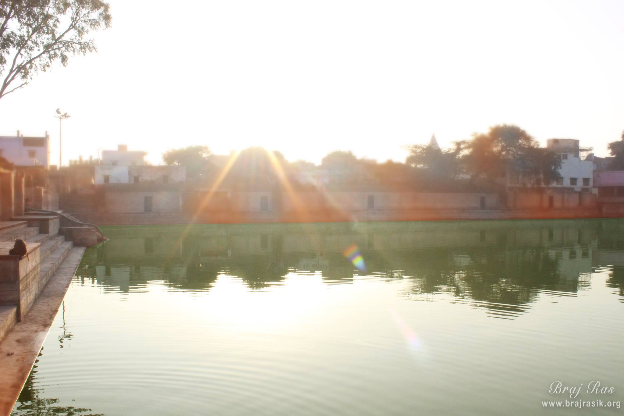 A sunny view of Shri Radha Kund.