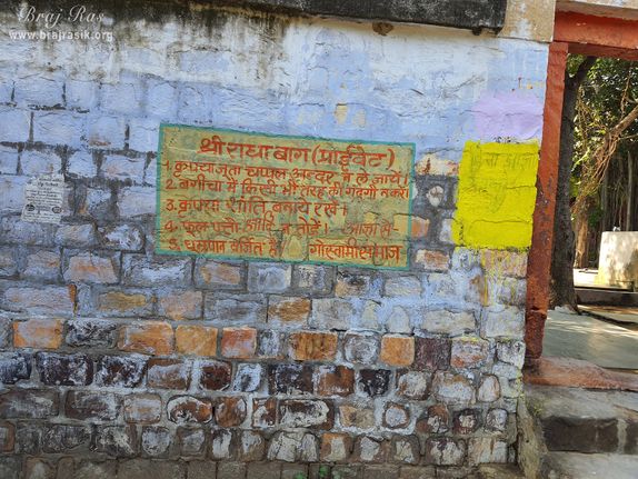 Information and rules written on the wall of entrance at Shri Radha Bag, Barsana