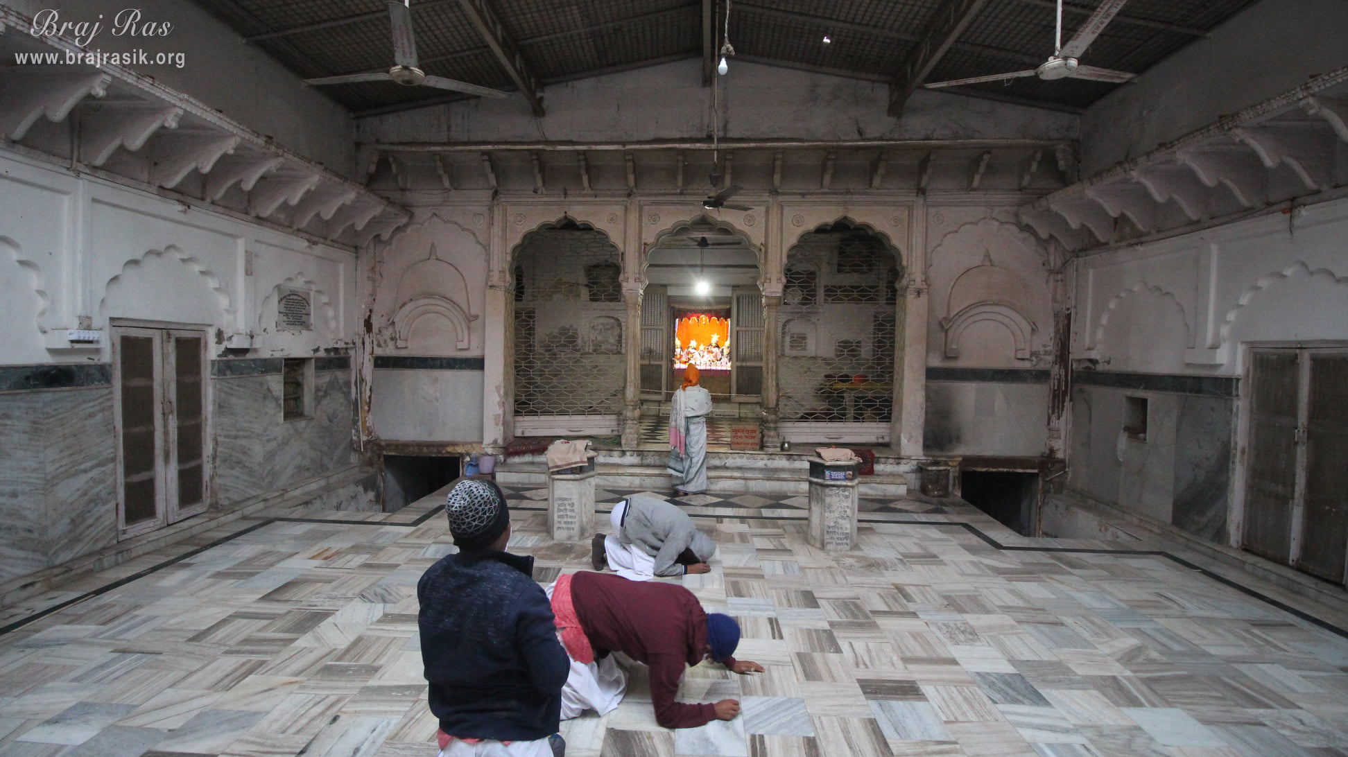 Devotees prostrating at Shri Radha Gokulananda Temple, Vrindavan
