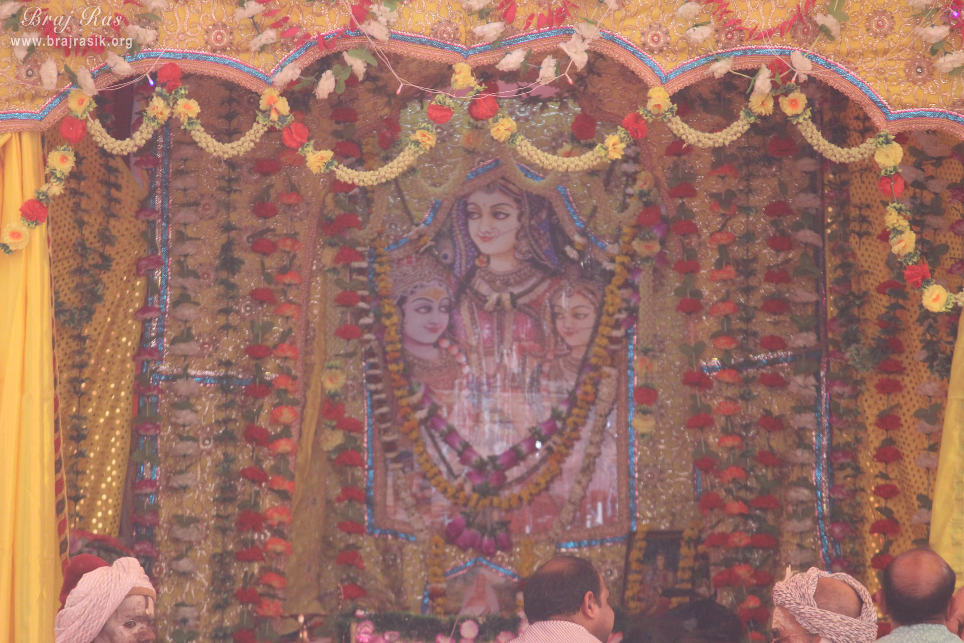 Shri Radha Krishna on the lap of Shri Lalita Sakhi in the camp of Haridasiya Radhaprasad Trust at Vrindavan Kumbh 2021