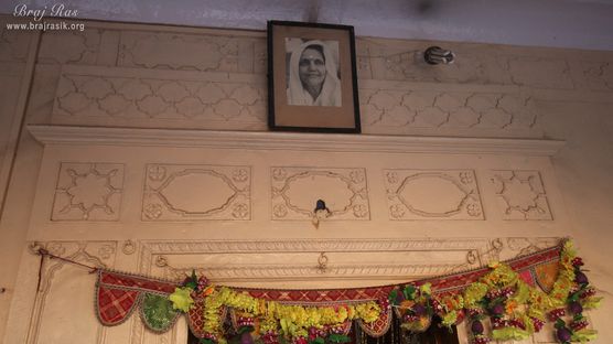 Photo of Maa Anandamayi above the door of temple at Shri Vrindavan Vihari Temple, Vardhman Kunj, Vrindavan