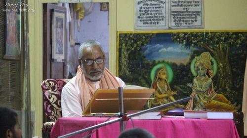 A Vaishnava saint giving spiritual discourse to devotees at Shri Roop Sanatan Gaudiya Math, Vrindavan