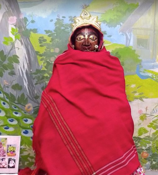 Shri Paurnamasi Ji in red attire at Shri Paurnamasi Devi (Yogmaya Temple), Vrindavan