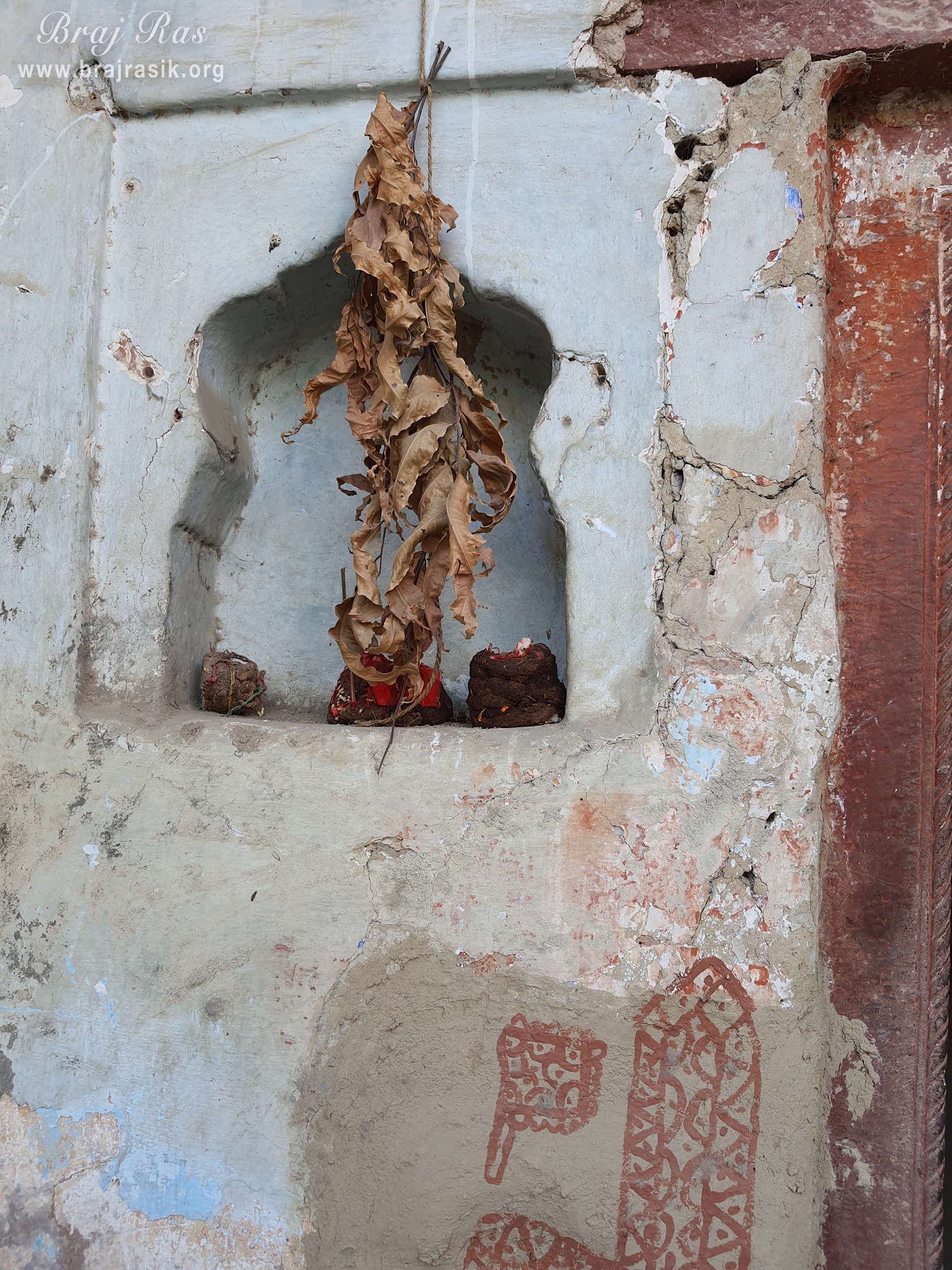 View of the space made for lamps in the wall at Ashtasakhi Temple - Barsana