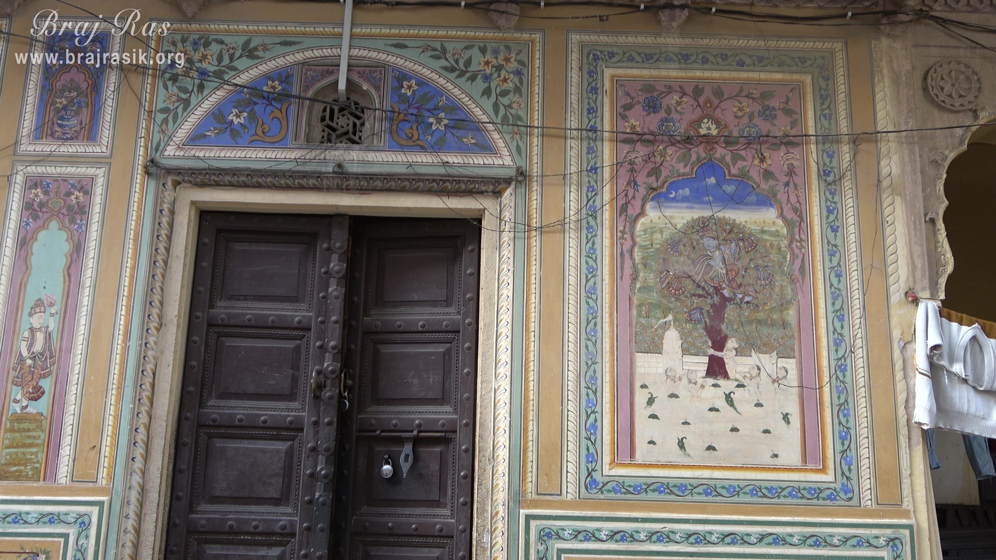 Painting of Lord Krishna stealing the clothes of milkmaids depicted on the wall at Shri Kushal Bihari Temple, Barsana