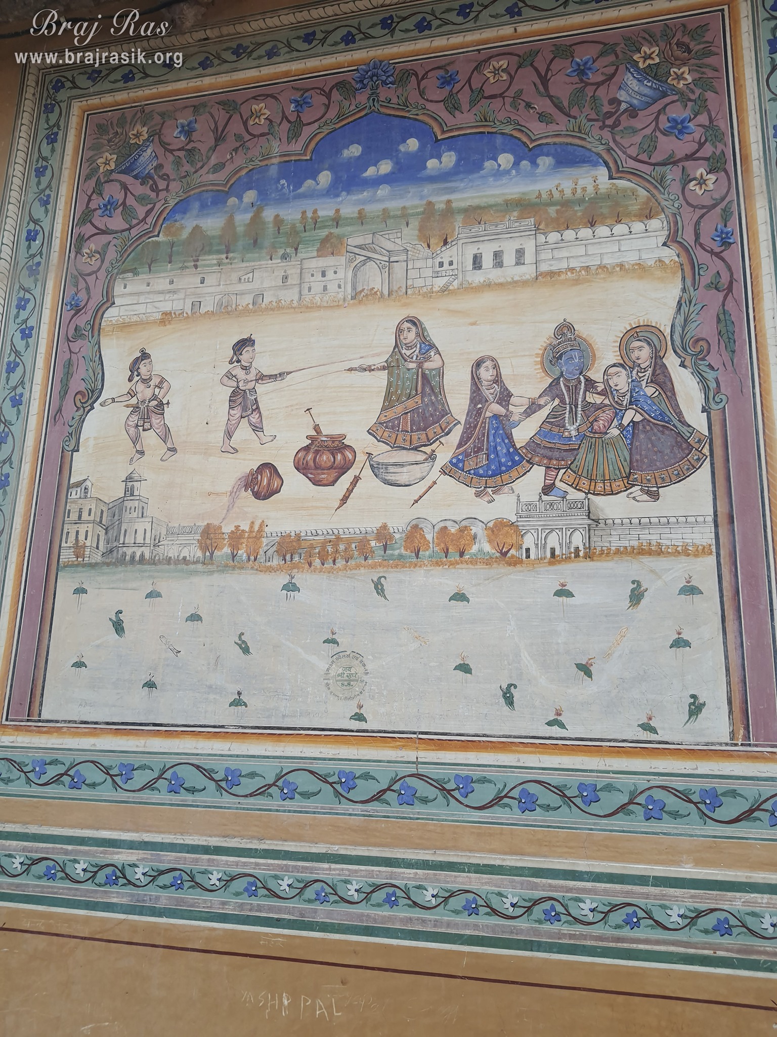 Painting of Shri Radha Krishna performing holi pastimes depicted on the wall at Shri Kushal Bihari Temple, Barsana