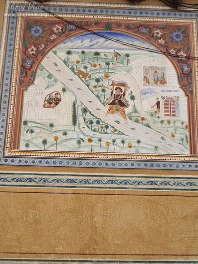 Painting of Vasudev crossing Yamuna Ji carrying Krishna depicted on the wall at Shri Kushal Bihari Temple, Barsana