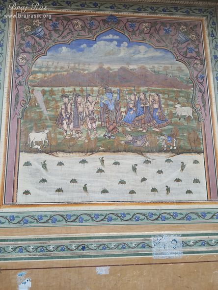 Painting of Lord Krishna carrying Govardhan Mountain depicted on the wall at Shri Kushal Bihari Temple, Barsana