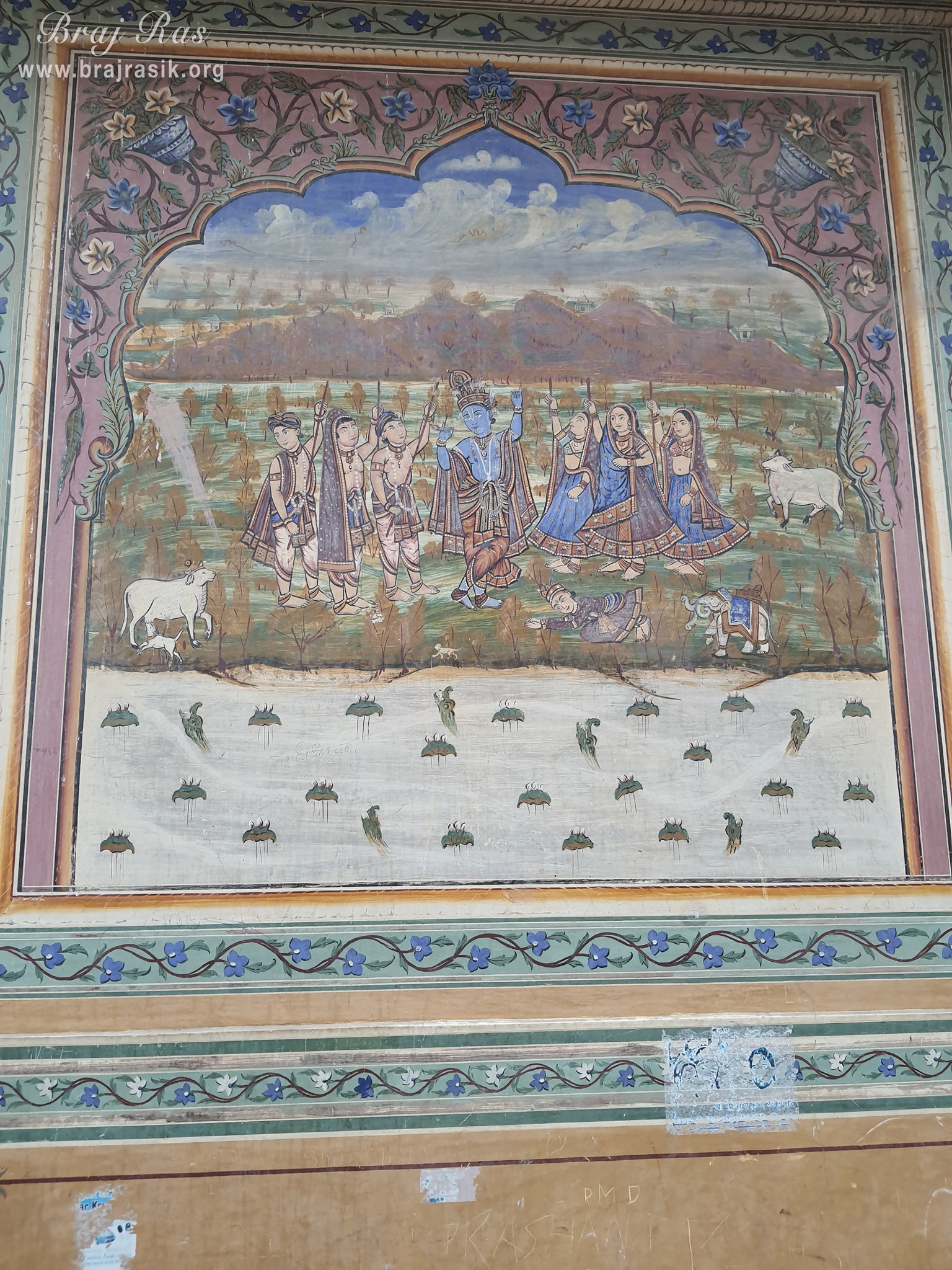 Painting of Lord Krishna carrying Govardhan Mountain depicted on the wall at Shri Kushal Bihari Temple, Barsana