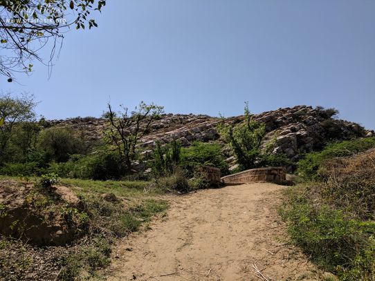 View of the dirt road going to Vyomasur's Cave in Kamyavan