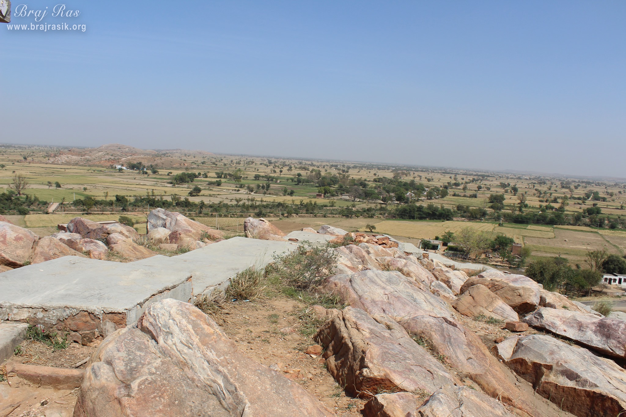 View of the nearby fields from the top of the hill at Vyomasur's Cave in Kamyavan