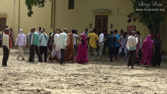Devotees walking in the sand of Ramanreti, Gokul - Braj. Here King Aaskaran Ji had a vision of such a Holi pastime, seeing which he stood there indifferently for 3 days