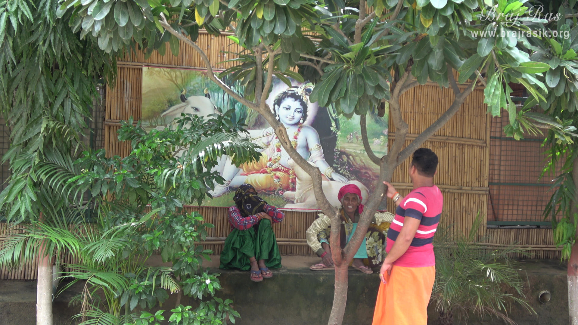 A beautiful picture of Shri Krishn with his cow is hanging on a hut at Ramanreti, Gokul - Braj.
