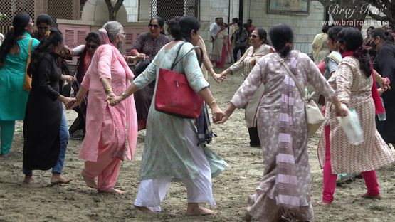 Devotees enjoying in the divine sand of Ramanreti, Gokul - Braj.